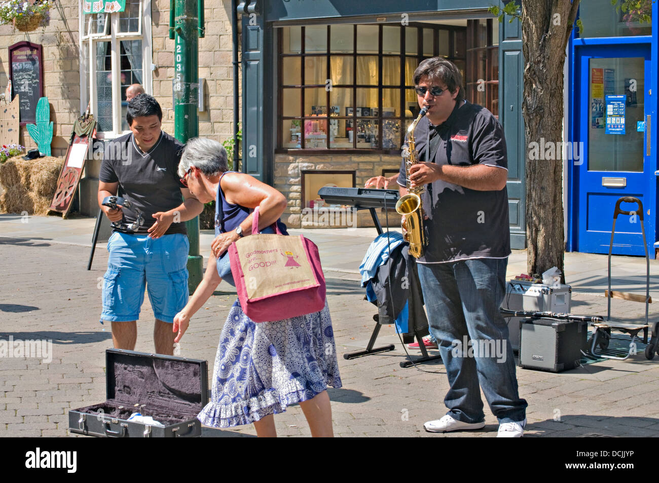 Landscape of some street entertainers in Buxton town centre, in the