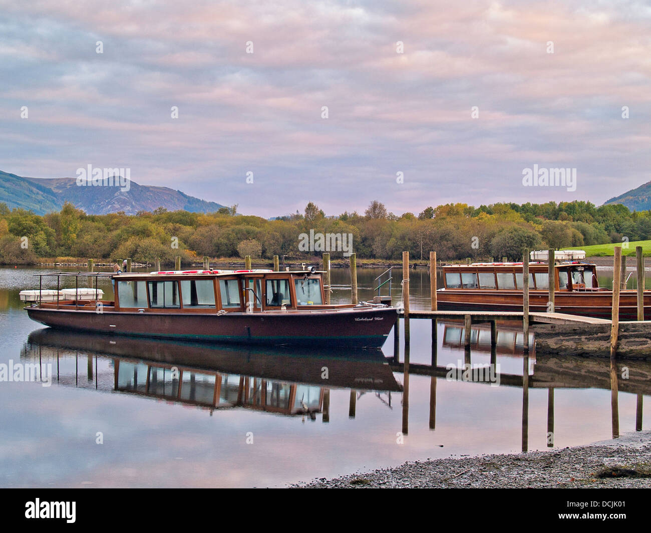 Motor boats in early morning light, Derwentwater, Cumbria, UK Stock Photo