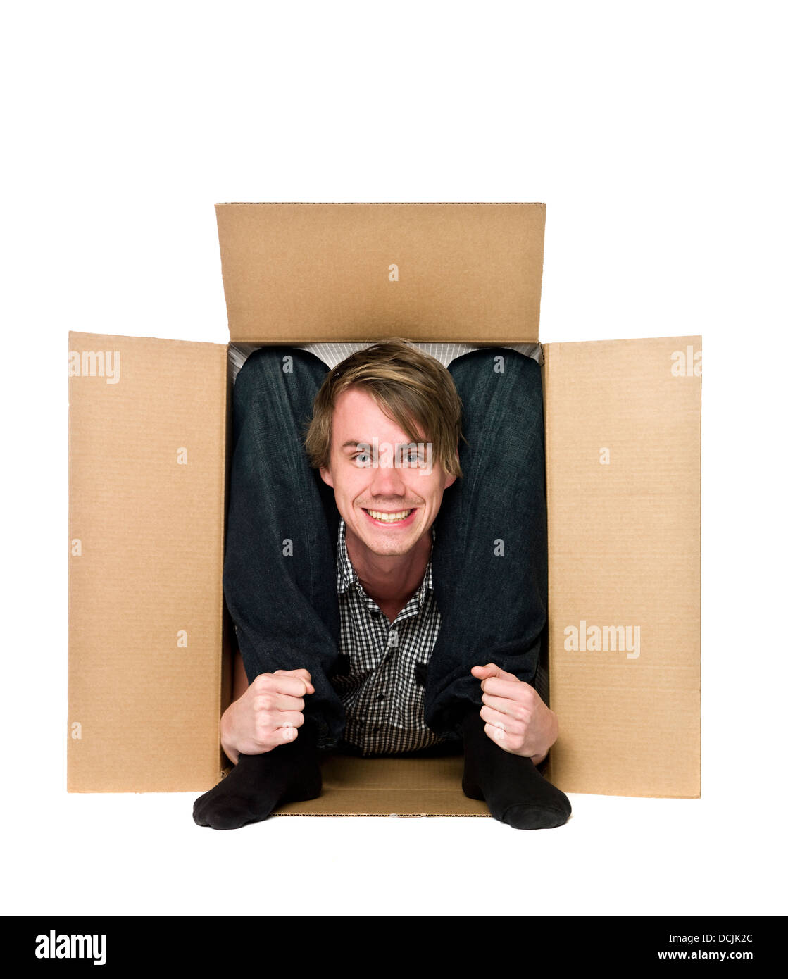 Acrobat inside of a cardboard box Stock Photo - Alamy
