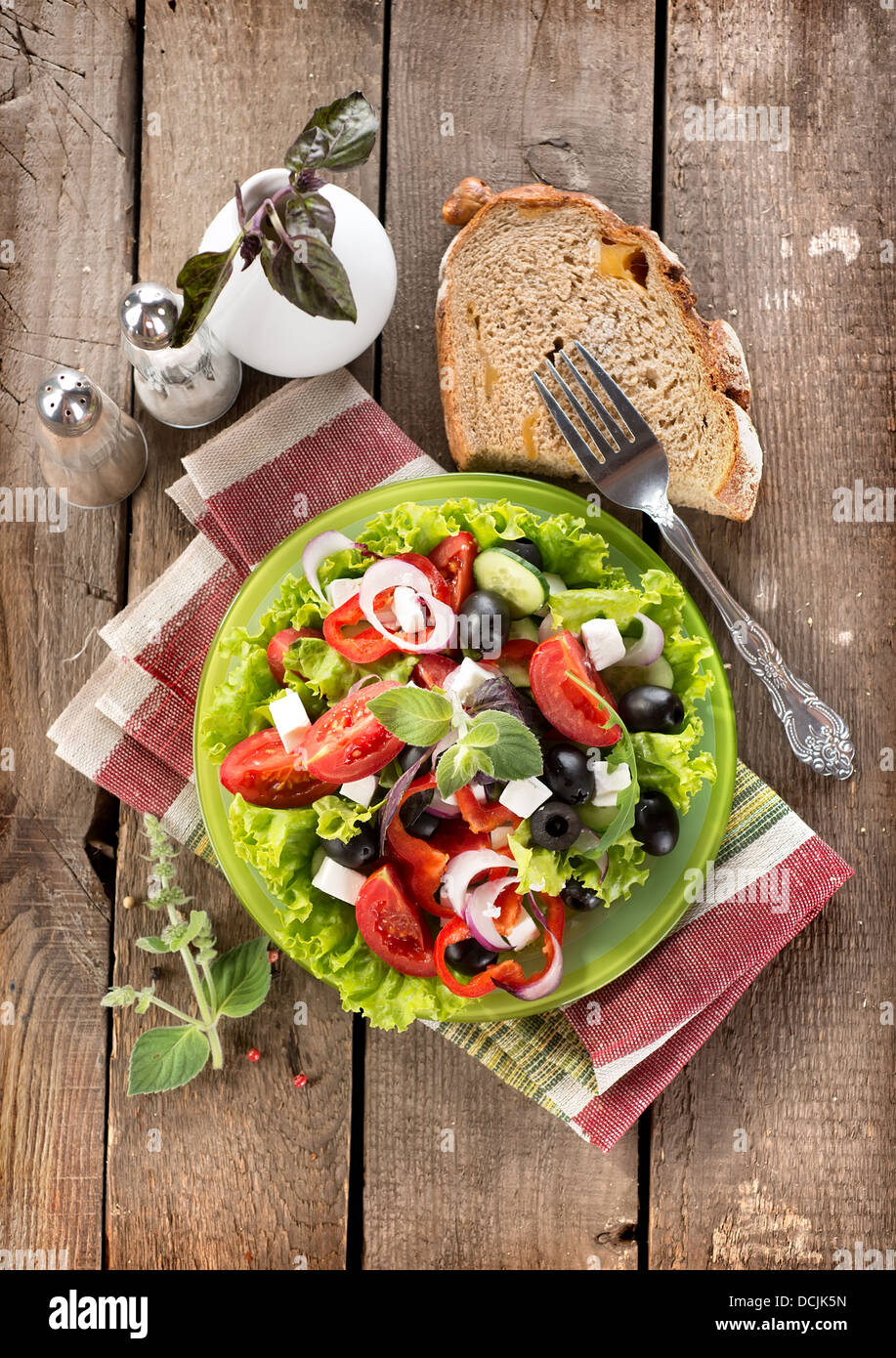 Tasty vegetable salad on a wooden background Stock Photo