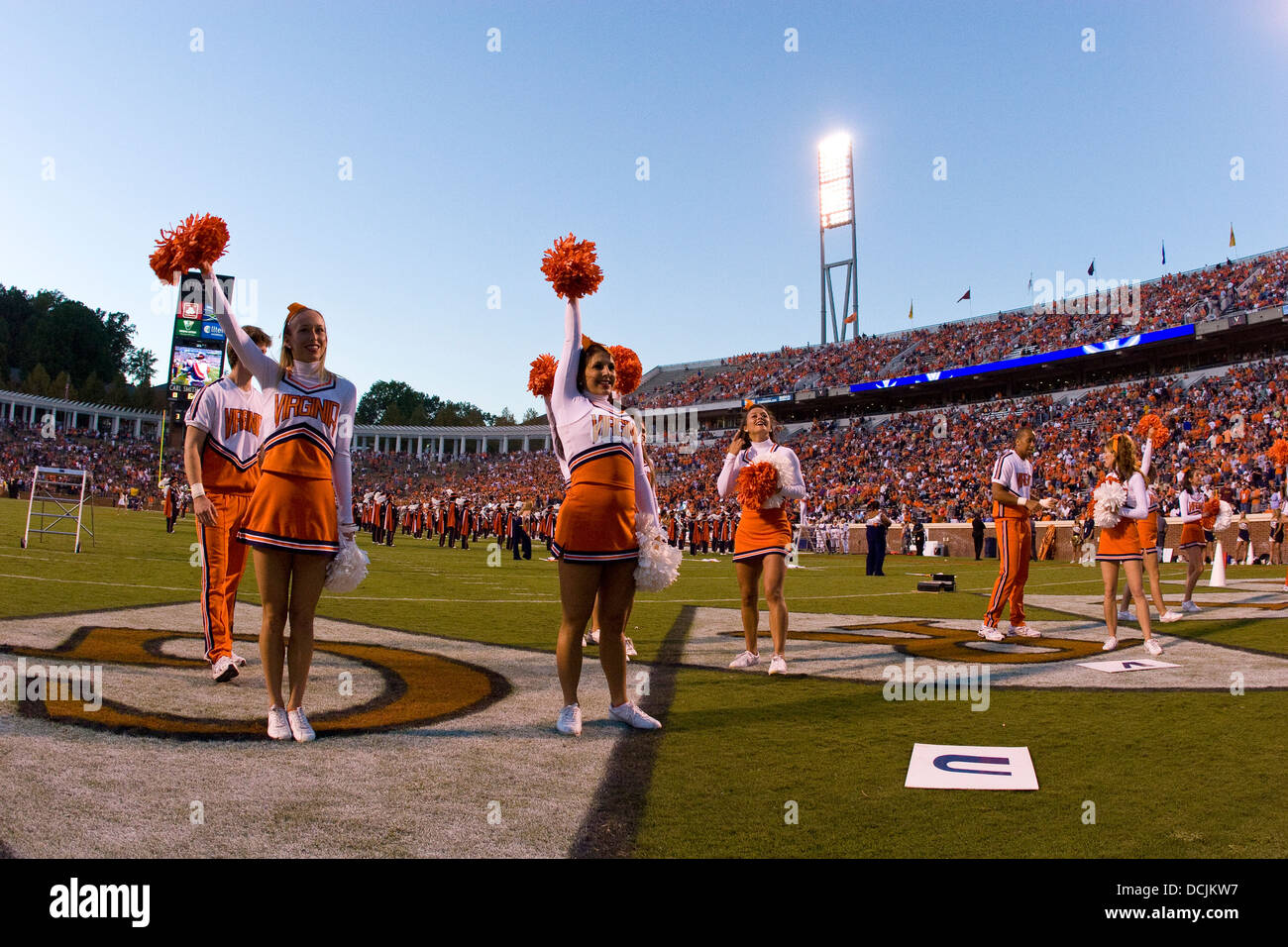 Virginia Cavalier cheerleaders preform on the field before a football