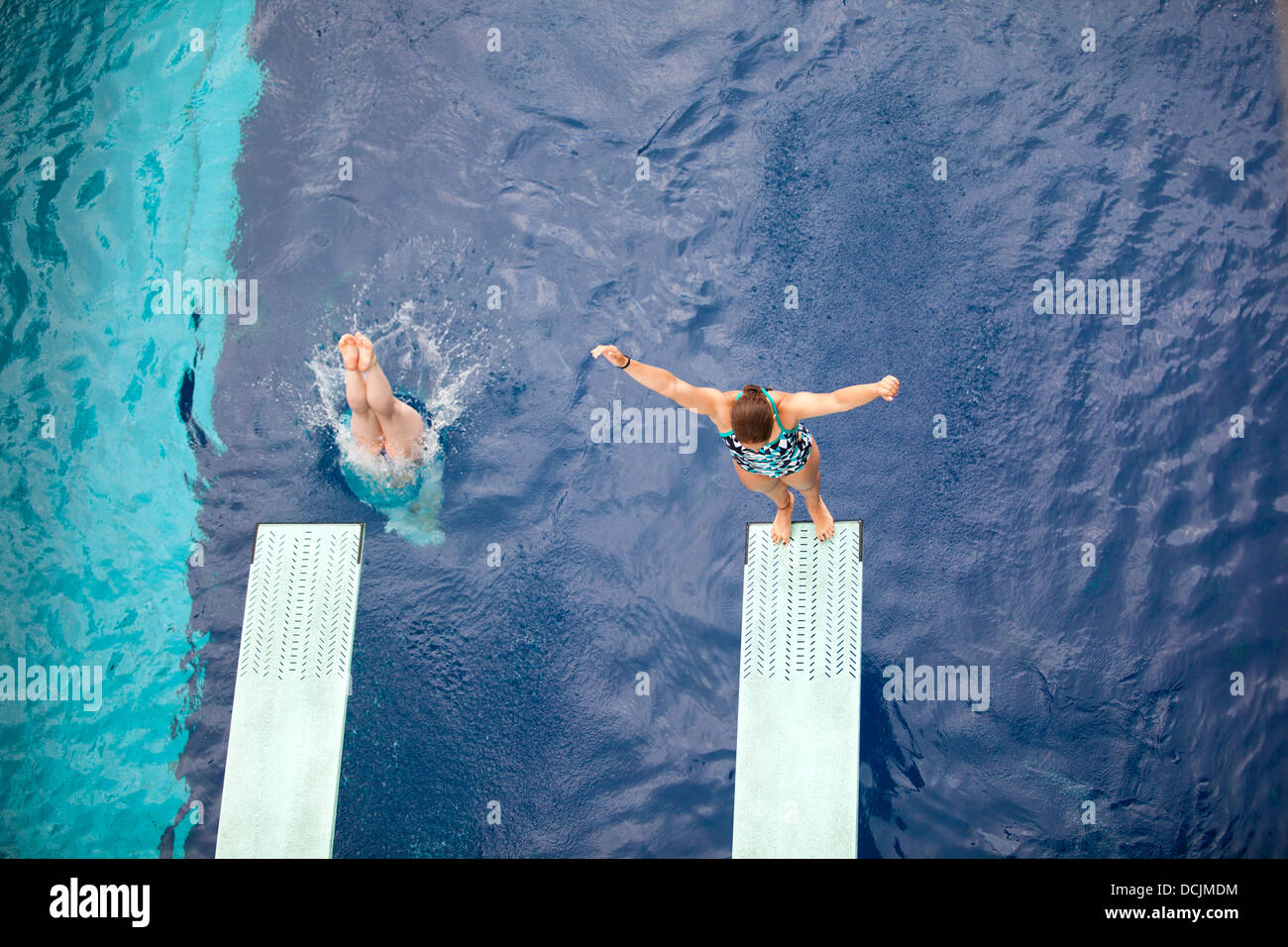 high divers jumping into the water Stock Photo Alamy