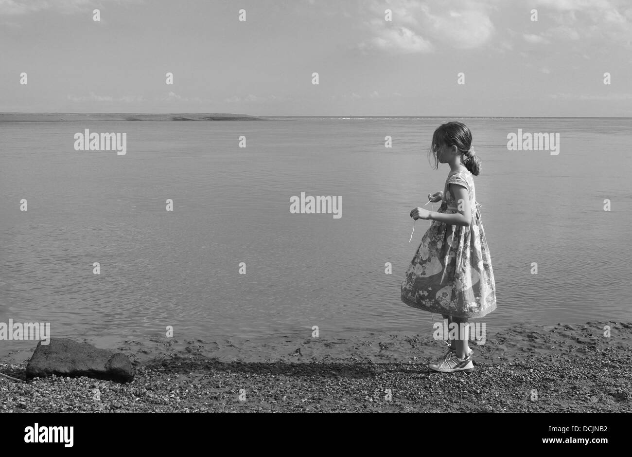 Girl alone at the seaside Stock Photo Alamy