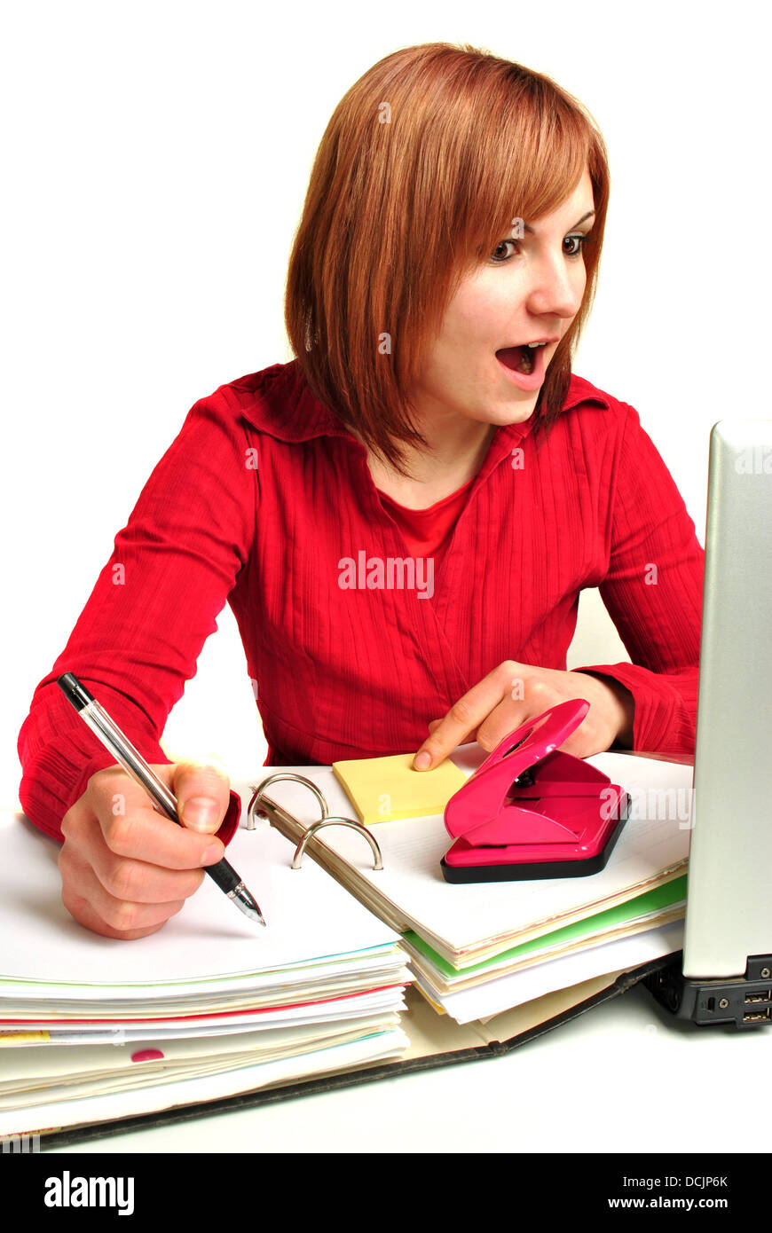 Office assistant in a red blouse makes notes Stock Photo Alamy