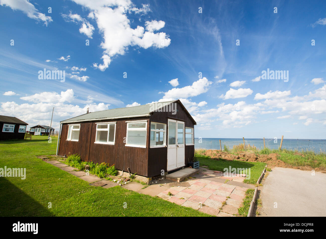 A chalet on a holiday park near the edge of collapsing coastal cliffs near Withernsea on