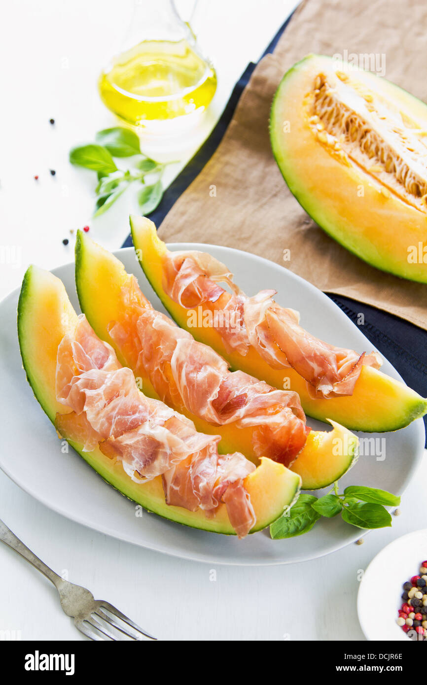 Fresh Cantaloupe with Prosciutto and basil Stock Photo Alamy