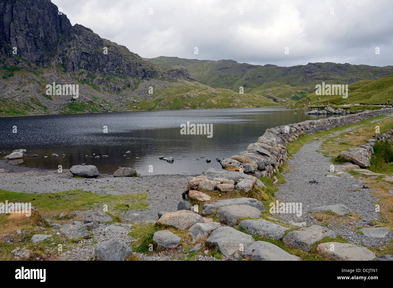 Dam at mouth of Stickle Tarn, popular tourist spot above the Langdale valley in the Lake District National Park. Stock Photo