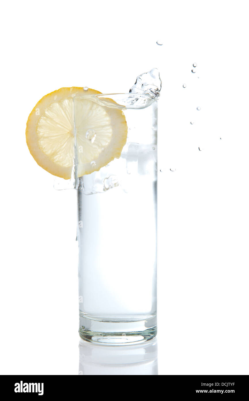 A tall glass of fresh water with a slice of lemon/splash. See other