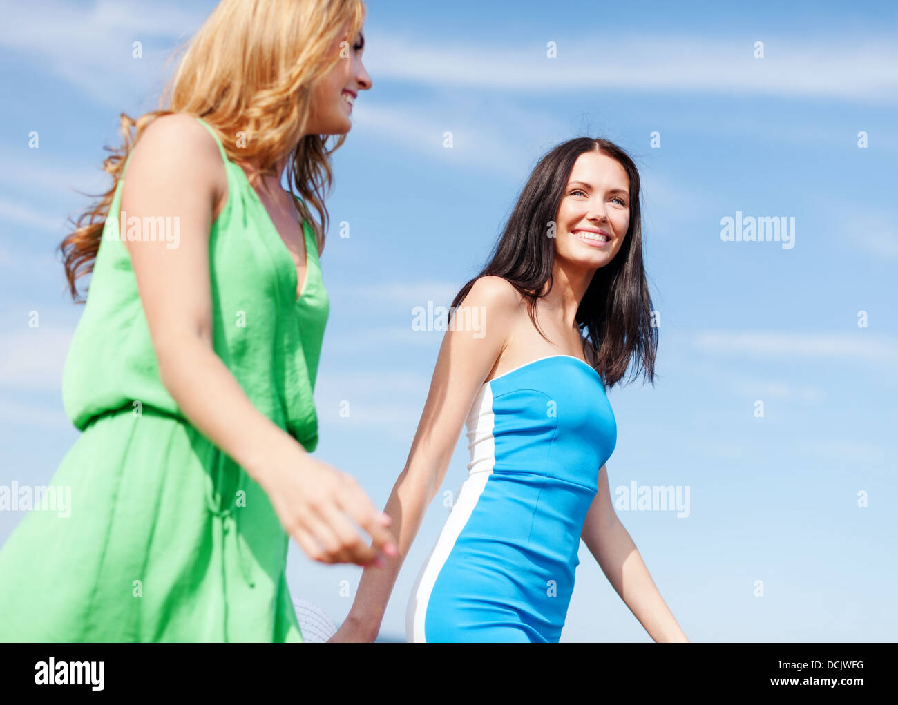 girls walking on the beach Stock Photo Alamy