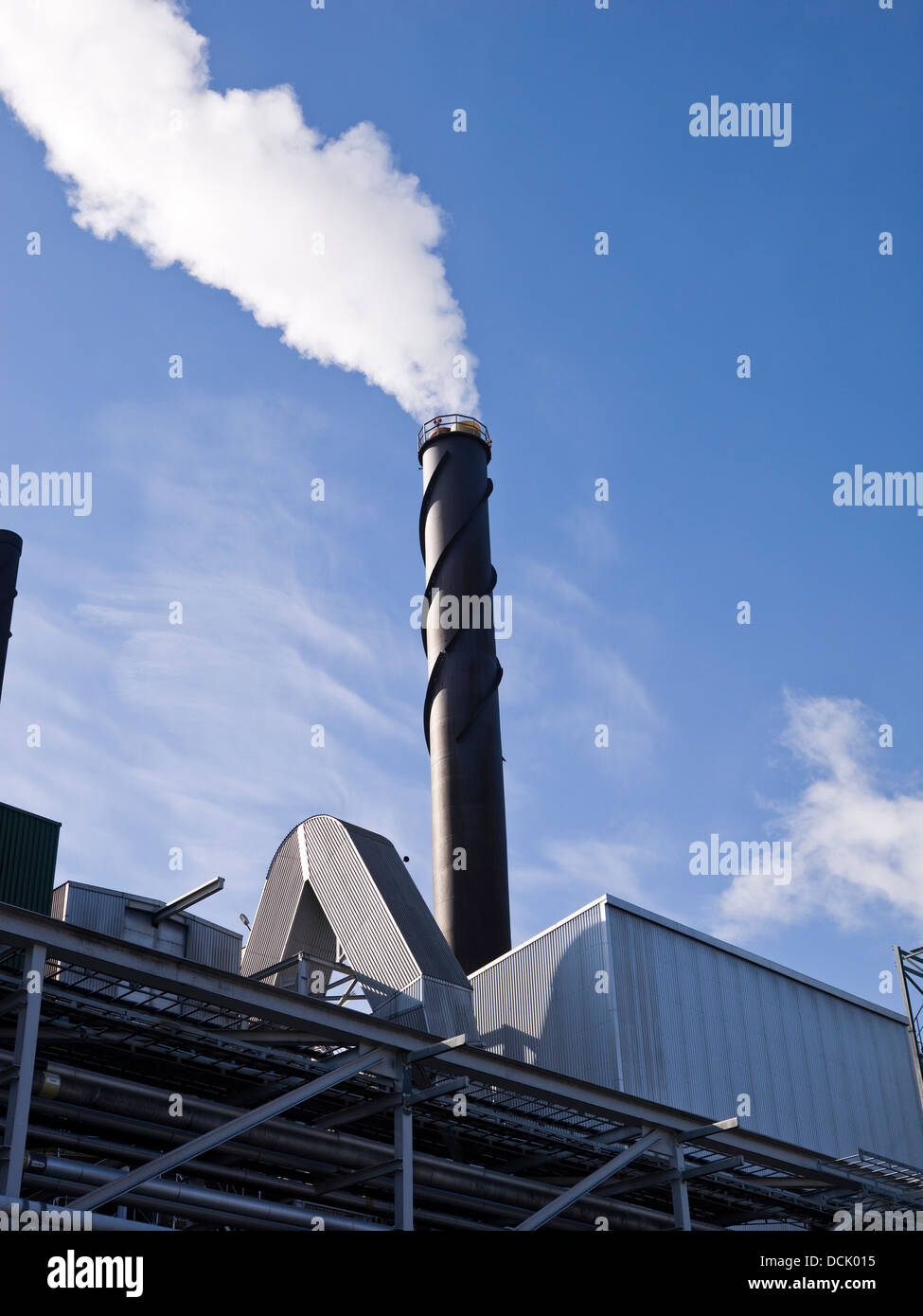 Chimney with smoke towards blue sky Stock Photo - Alamy