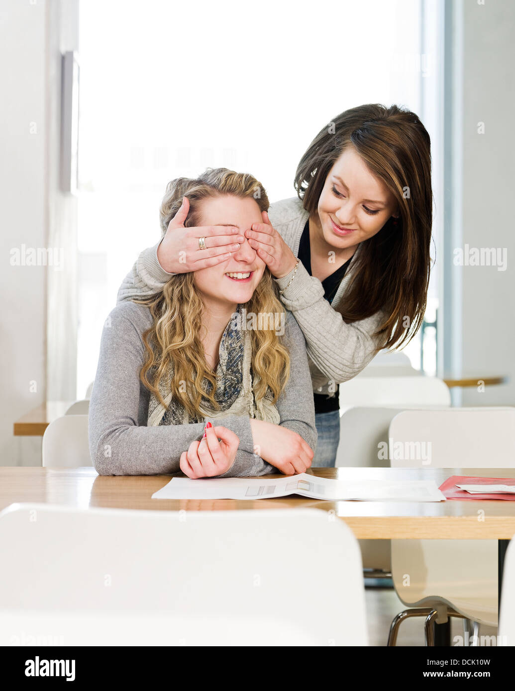 two girls playing peek a boo Stock Photo
