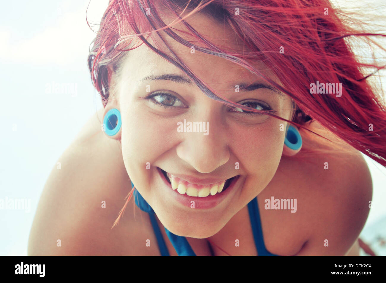 Closeup of a beautiful smiling young woman with red hair Stock Photo ...