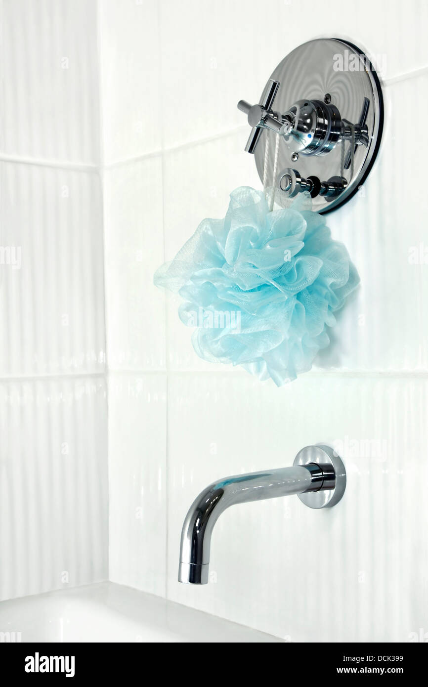 White tiled shower stall faucets Stock Photo