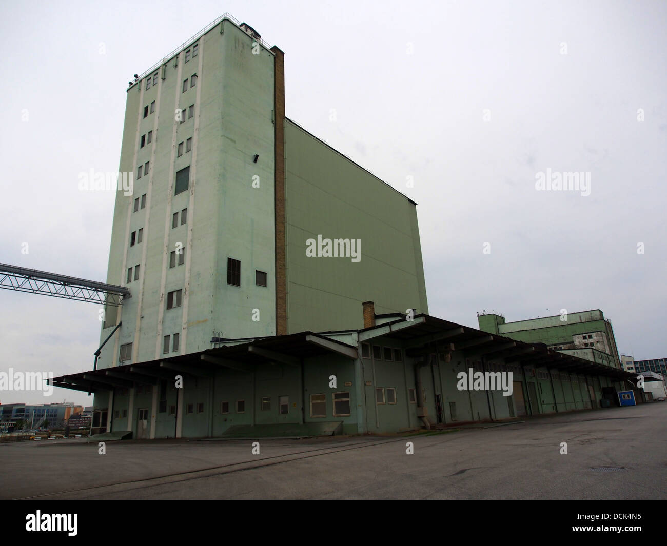 A warehouse or silo in the Malmö harbor, Sweden, serves as a key component in the region’s logistics infrastructure. These structures are used for storing bulk materials and goods in transit. Stock Photo