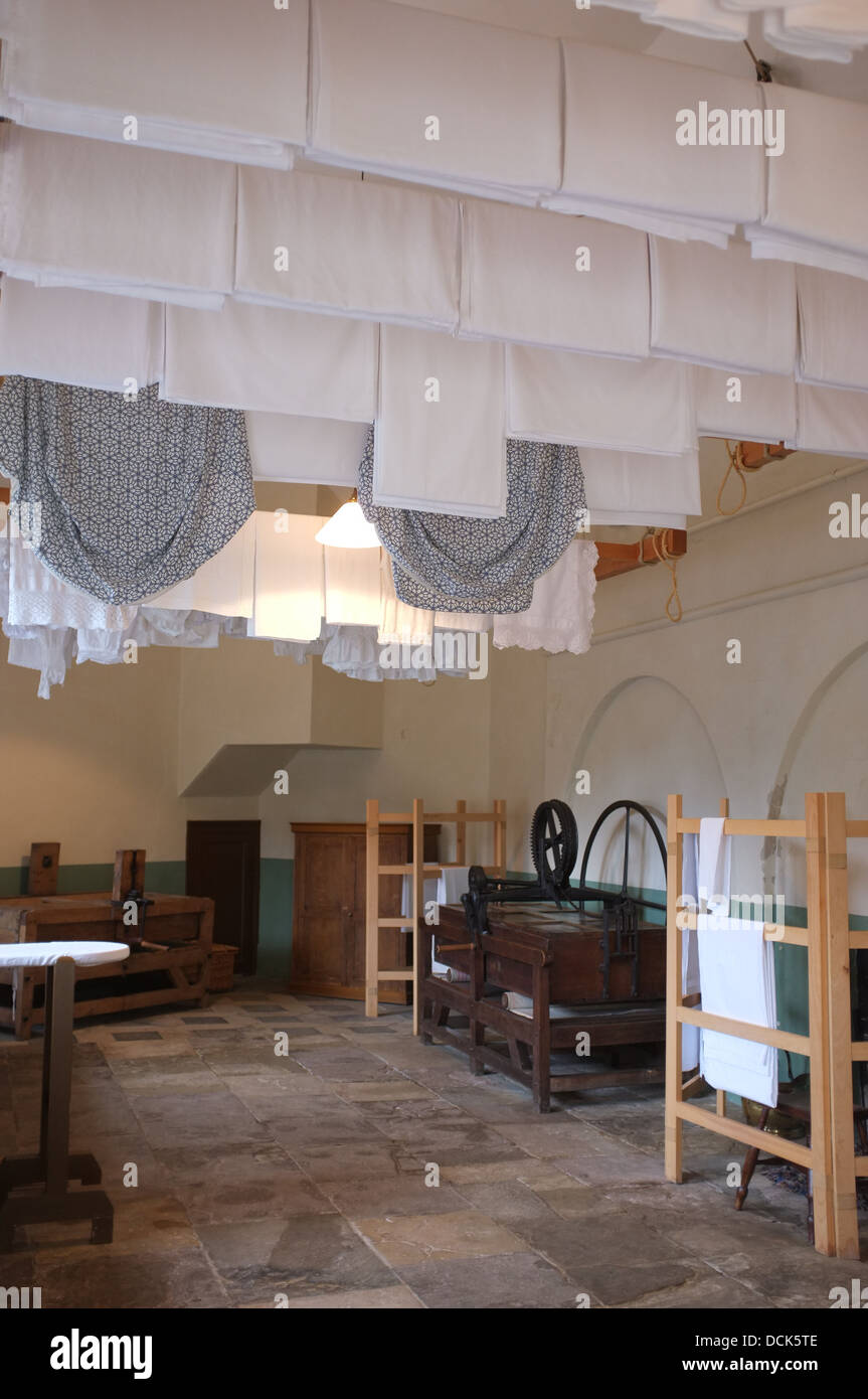 Victorian Laundry Room With Sheets Hanging From Ceiling