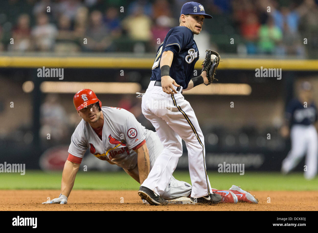 Milwaukee, Wisconsin, USA. 19th Aug, 2013. August 19, 2013: St. Louis Cardinals left fielder Matt Holliday #7 looks up toward the umpire for the call after sliding into second base with a double during the Major League Baseball game between the Milwaukee Brewers and the St. Louis Cardinals at Miller Park in Milwaukee, WI. John Fisher/CSM. © csm/Alamy Live News Stock Photo