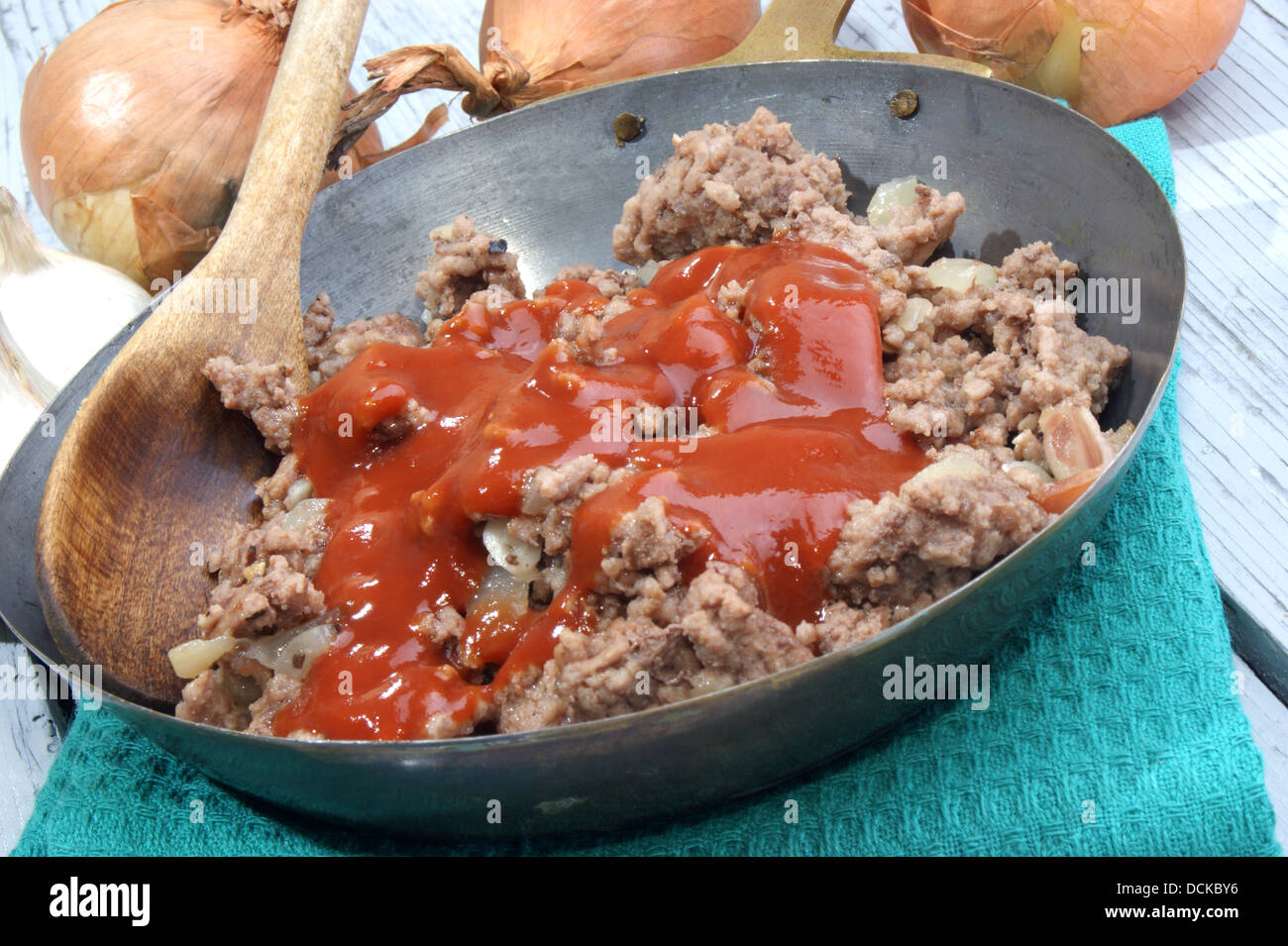 minced meat with tomato sauce in a brass pan Stock Photo Alamy