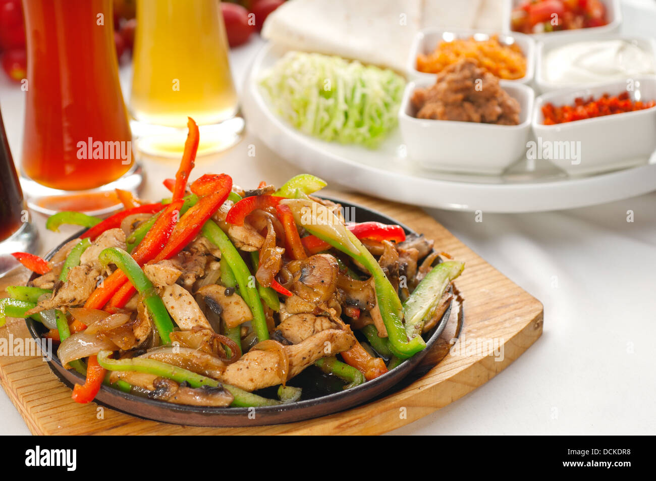 original fajita sizzling hot on iron plate Stock Photo Alamy
