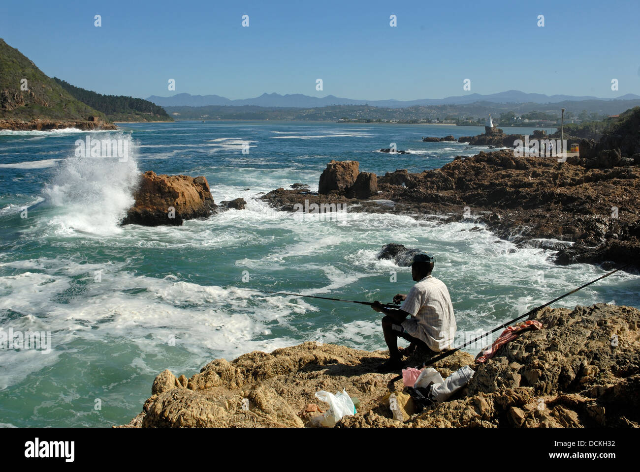 South Africa, Knysna, 2009. Fishermen fishing at The Heads, as the tide