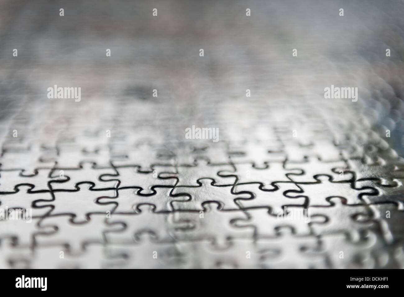 Jigsaw puzzle interlocking pieces pattern to solve meshed together in