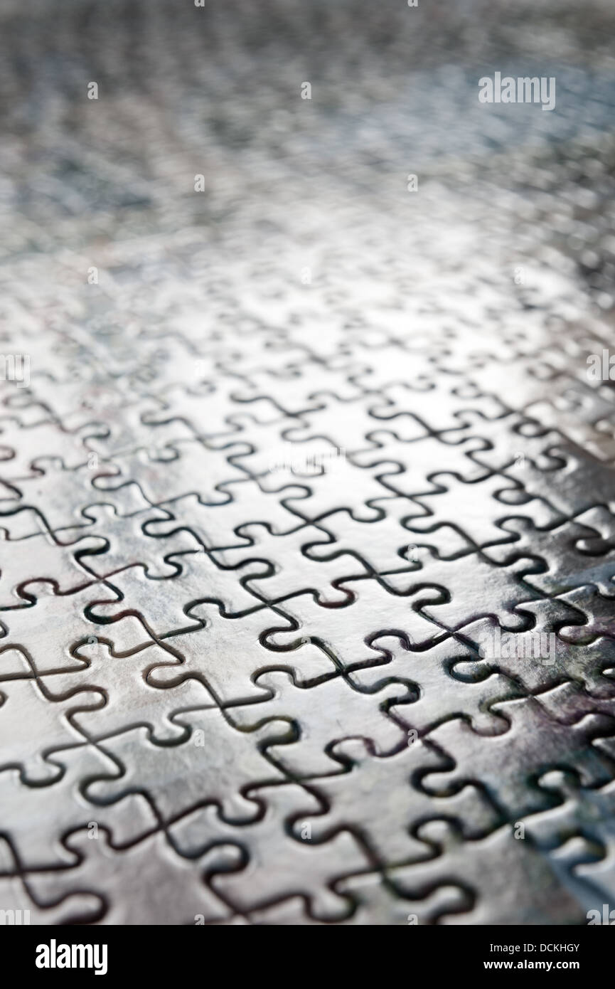 Jigsaw puzzle interlocking pieces pattern to solve meshed together in