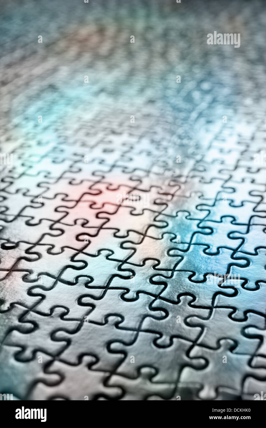 Jigsaw puzzle interlocking pieces pattern to solve meshed together in