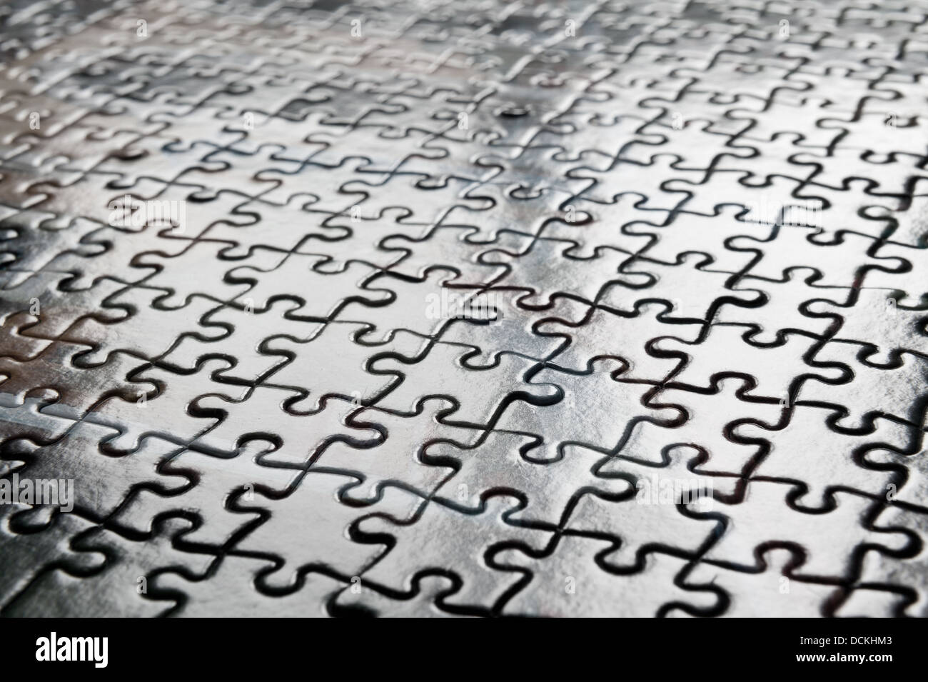 Jigsaw puzzle interlocking pieces pattern to solve meshed together in