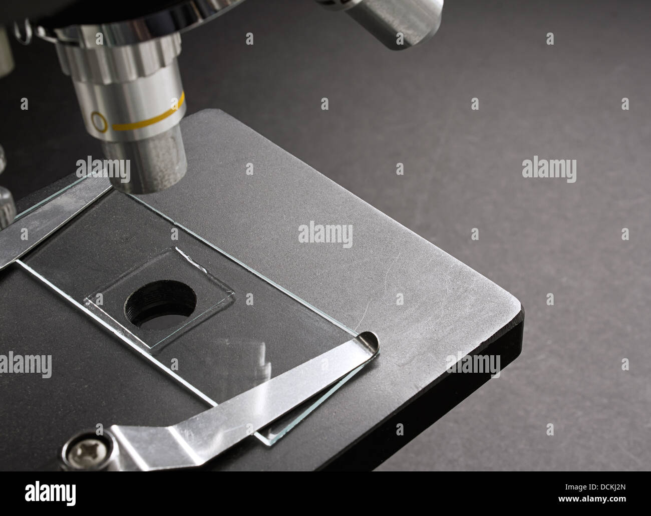 microscope with mounted glass slide on for microscopic inspection of cells Stock Photo