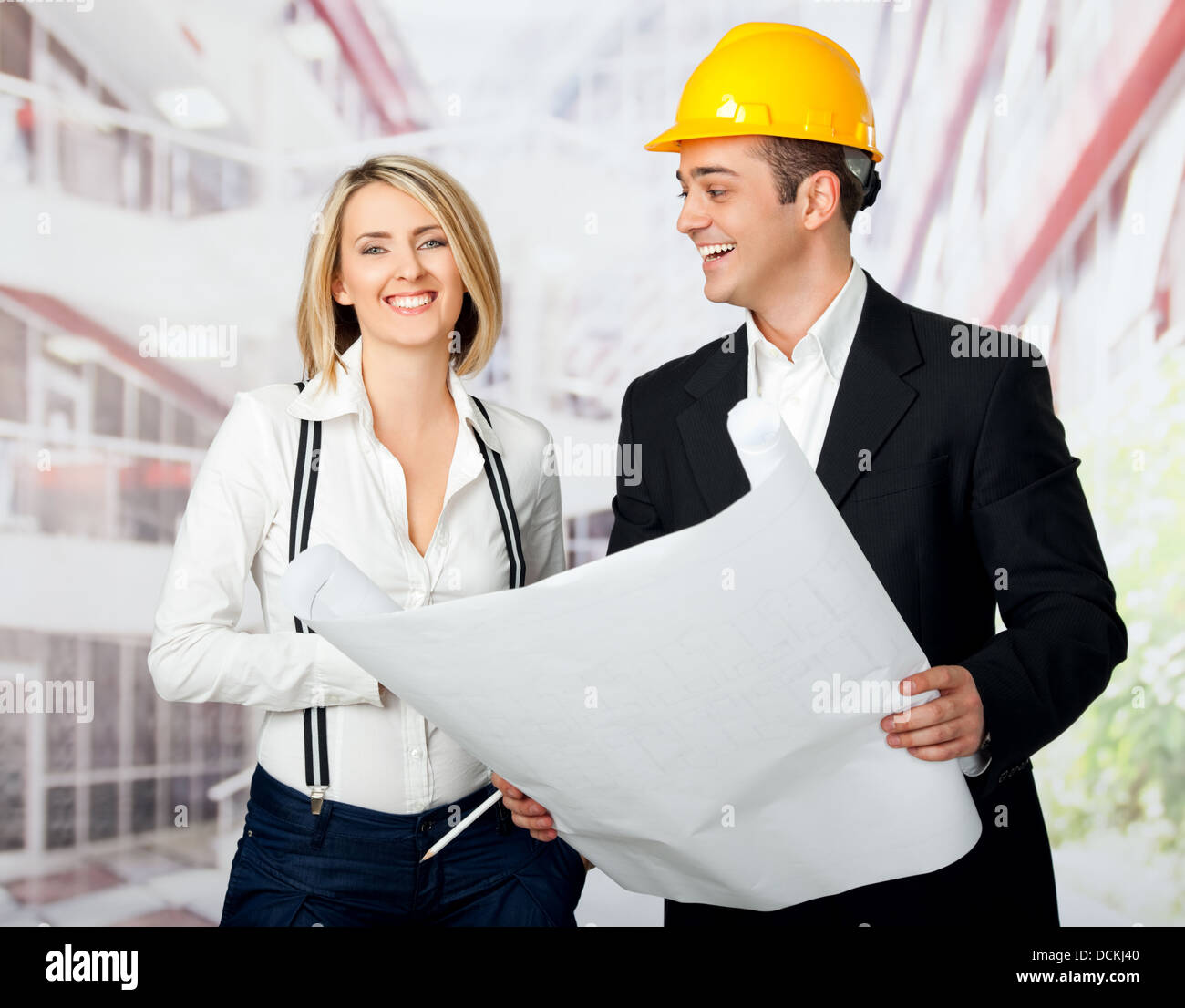 Happy male and female architects Stock Photo - Alamy