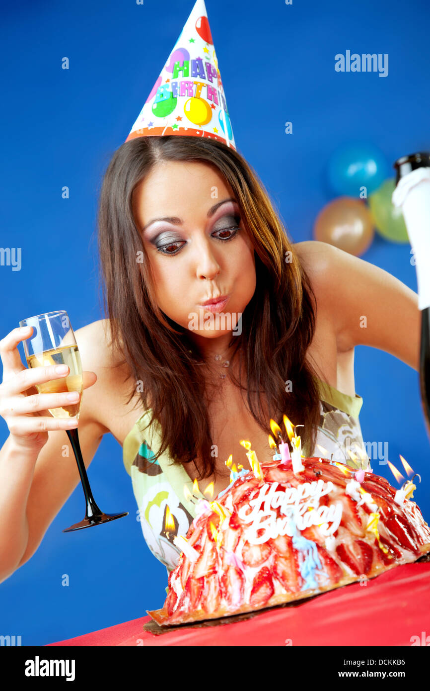 Woman blowing birthday candles Stock Photo Alamy