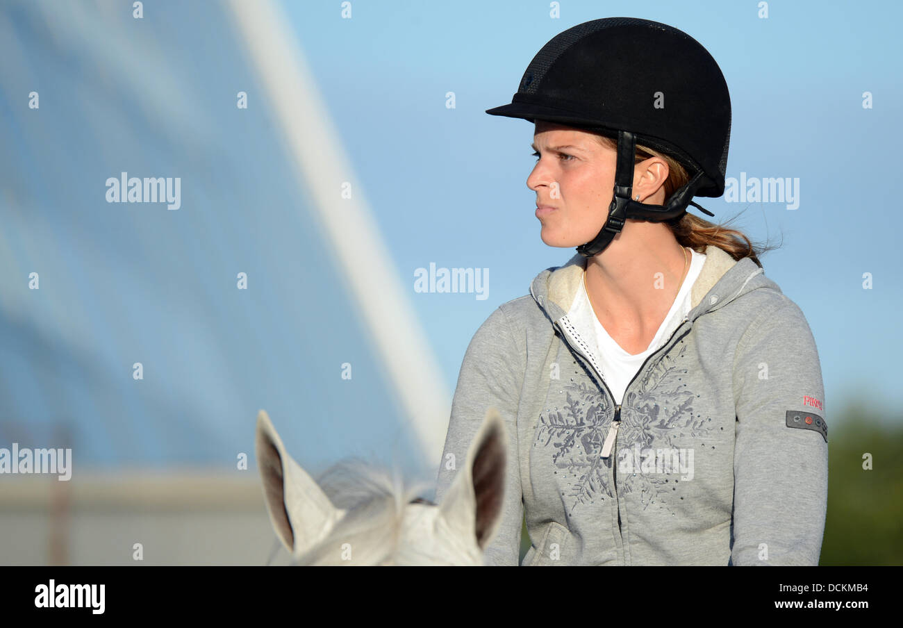 Herning, Denmark. 19th Aug, 2013. Greek show jumper Athina Onassis de Miranda is on her way to a training in the evening during the European Show Jumping and Dressage Championships in Herning, Denmark, 19 August 2013. Photo: JOCHEN LUEBKE/dpa/Alamy Live News Stock Photo