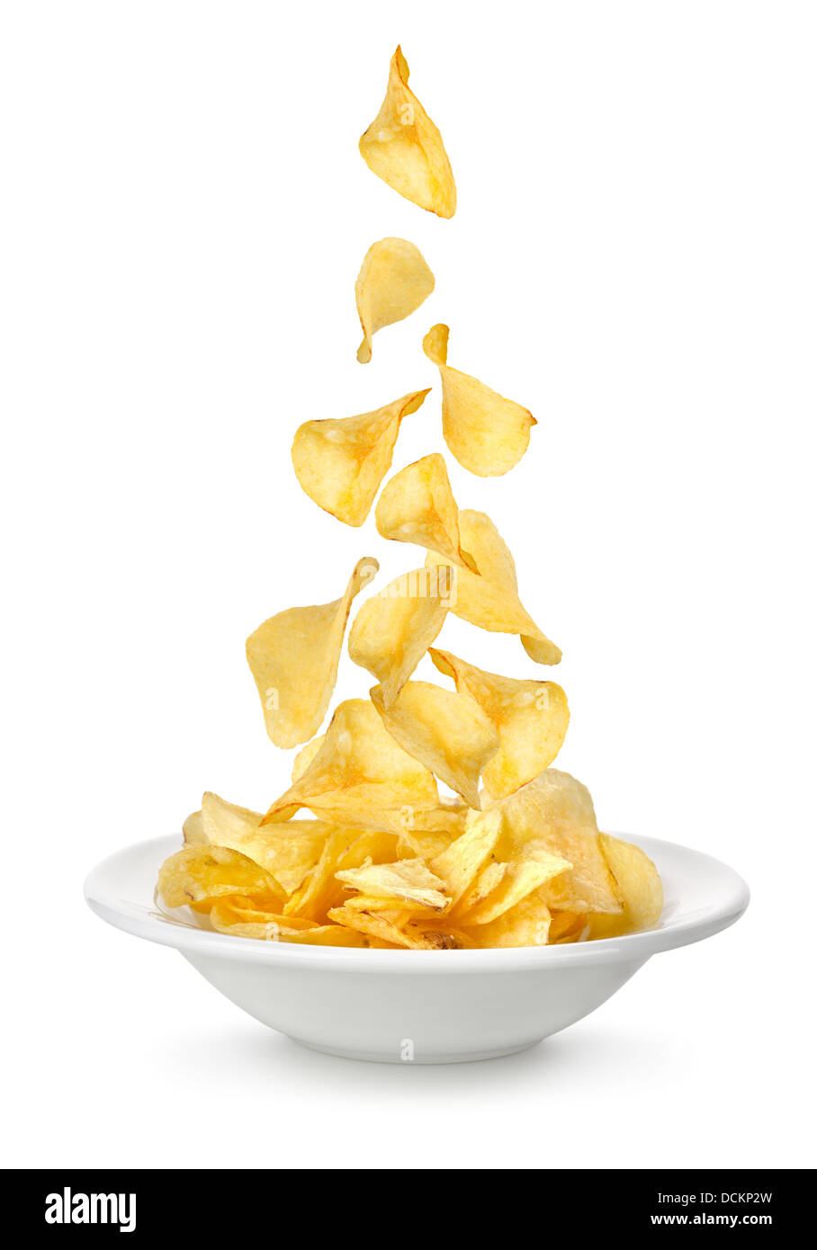 Potato chips falling in the plate Stock Photo Alamy