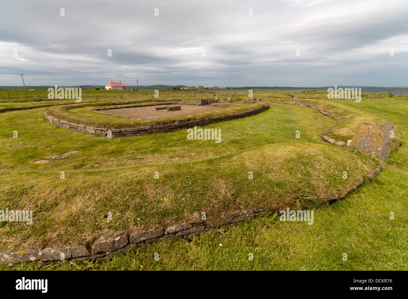 Structure 8 of the Barnhouse Neolithic Village with the Ness of Brodgar in the background, Orkney islands. Stock Photo