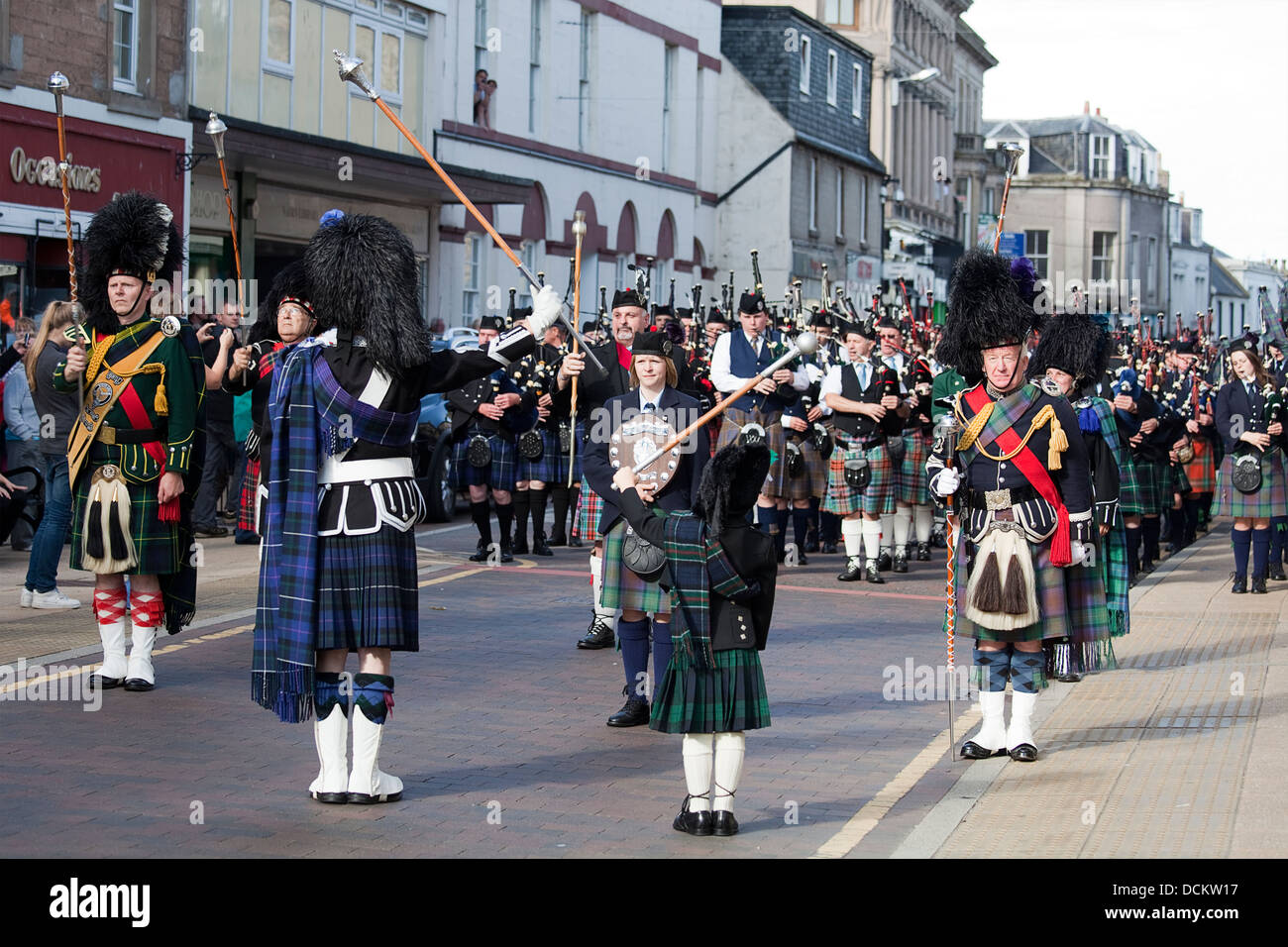 Nairn, Scotland - August 17th, 2013: Drum Majors leading their marching bands through the high street in Nairn. Stock Photo