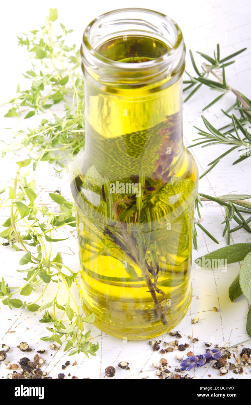 olive oil with herbs in a bottle Stock Photo Alamy