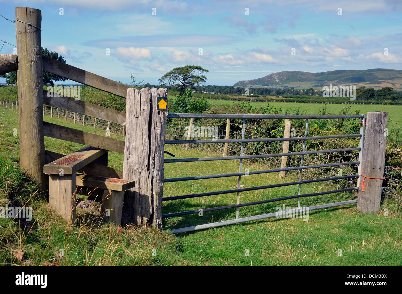 Traditional stile and seven bar steel gate on a footpath near ...