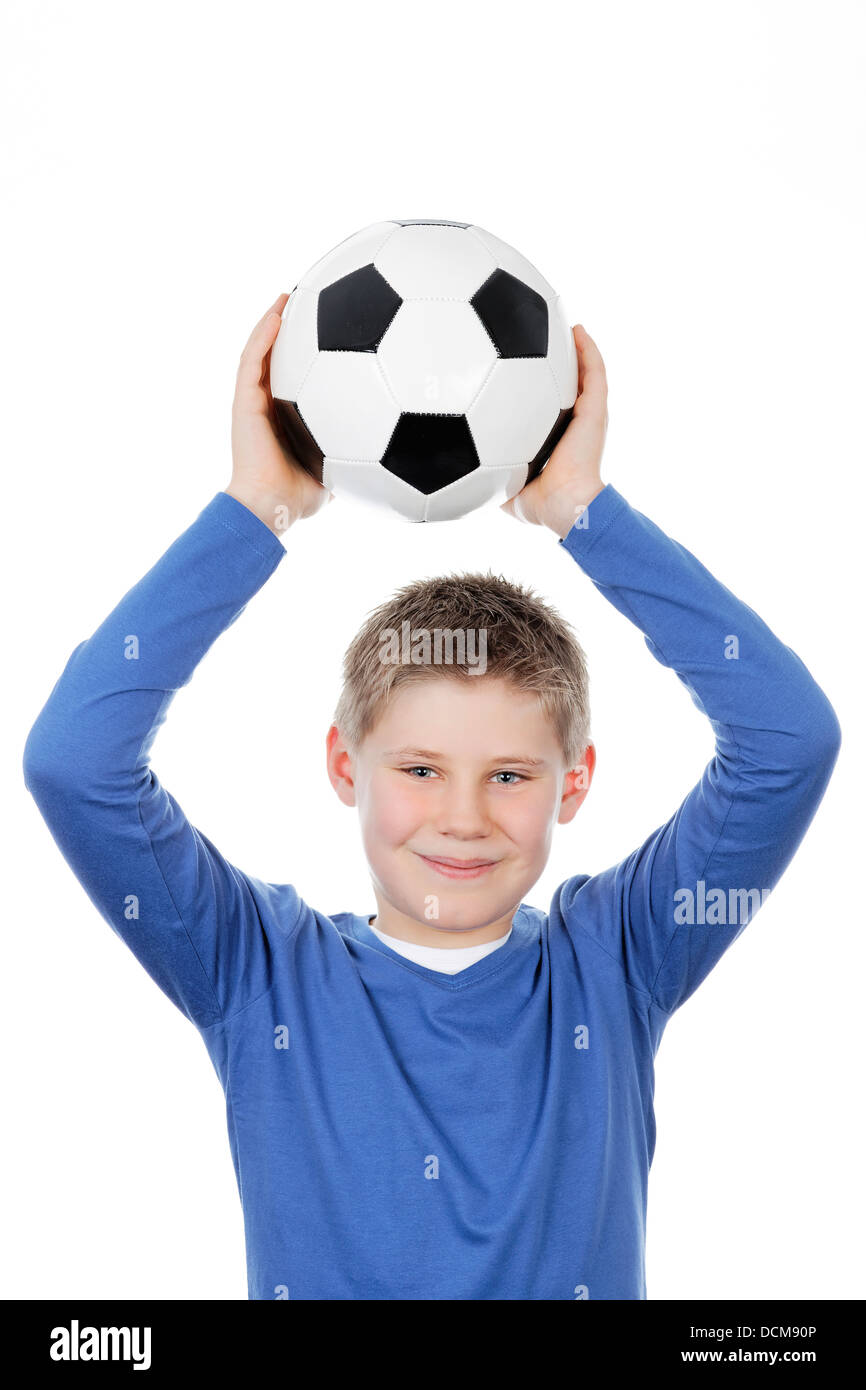 Cute boy holding a football ball Stock Photo