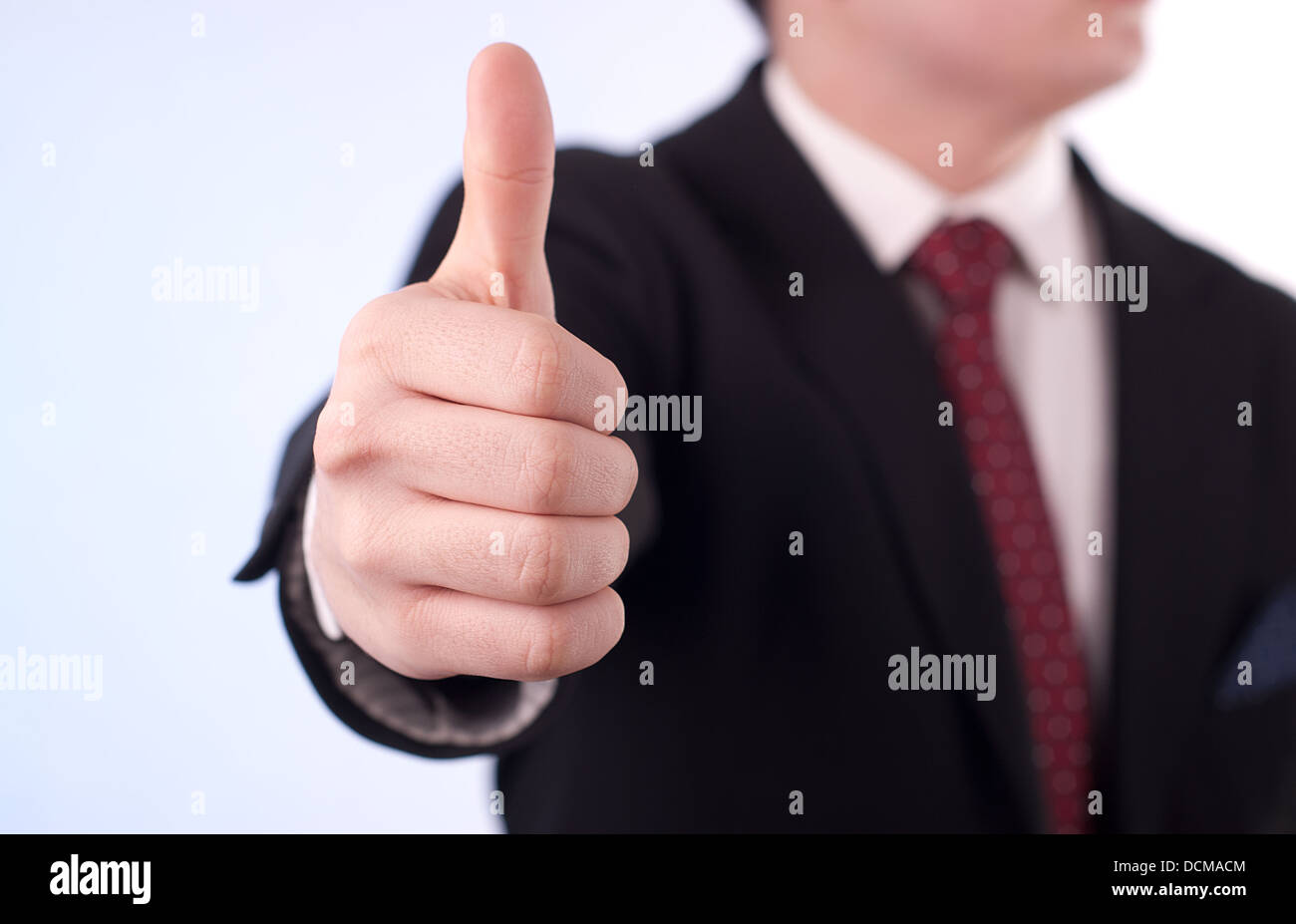 Young professional shows fingers arranged in O'K sign Stock Photo