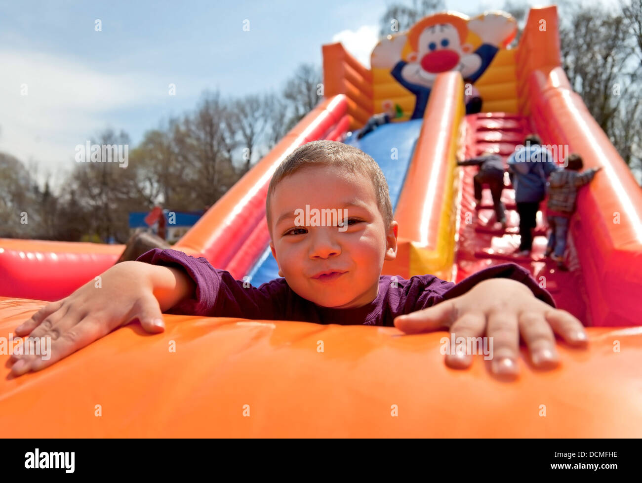 Boy inflatable slide Stock Photo - Alamy