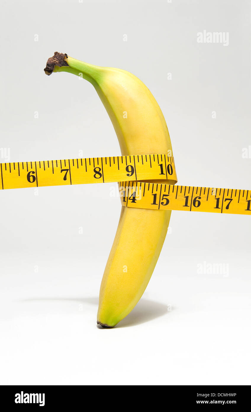 tape measure wrapped around yellow banana Stock Photo
