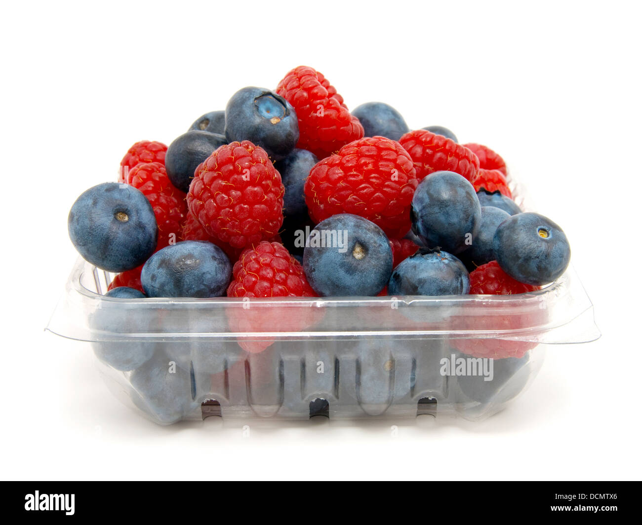 Basket with a raspberry and a blueberry on a white background Stock ...