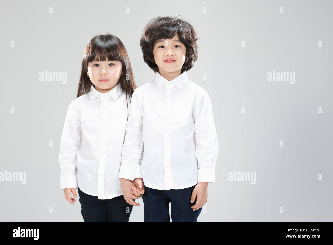 a boy and a girl standing together Stock Photo - Alamy