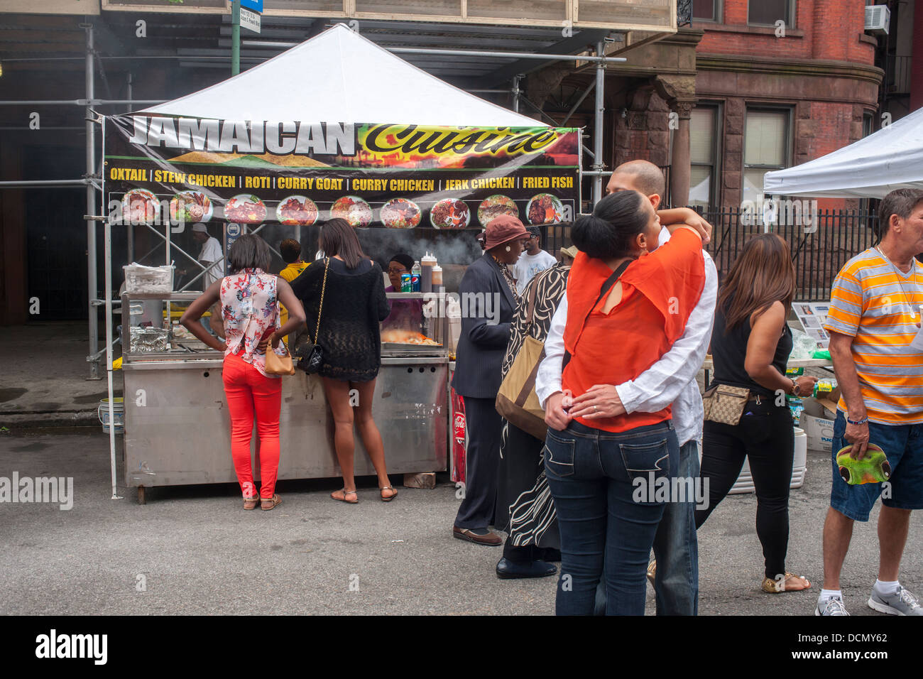 Jamaican cuisine sold at the Harlem Week street fair on West 135th Street in Harlem in New York Stock Photo