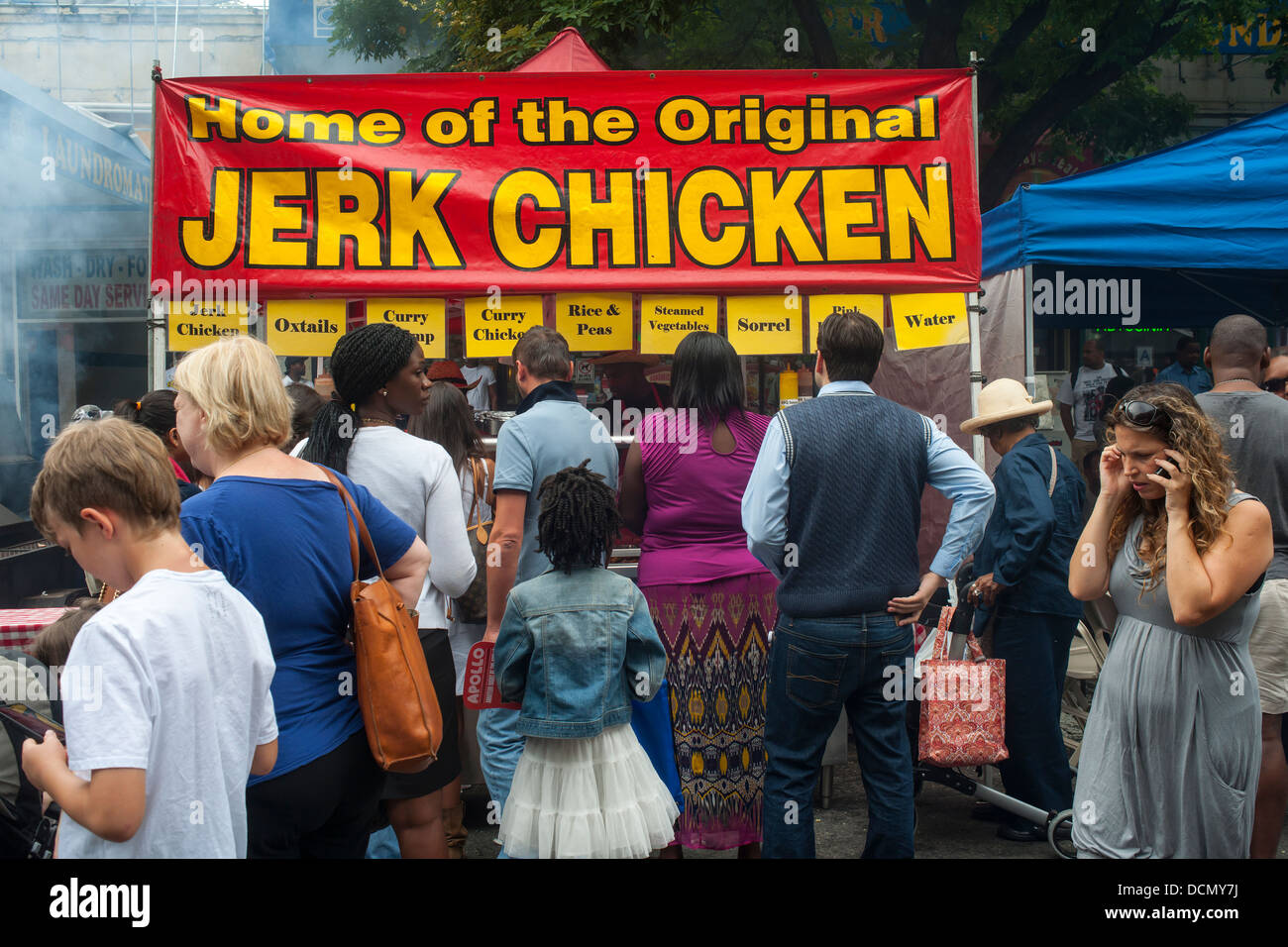 Jerk chicken sold at the Harlem Week street fair on West 135th Street in Harlem in New York Stock Photo