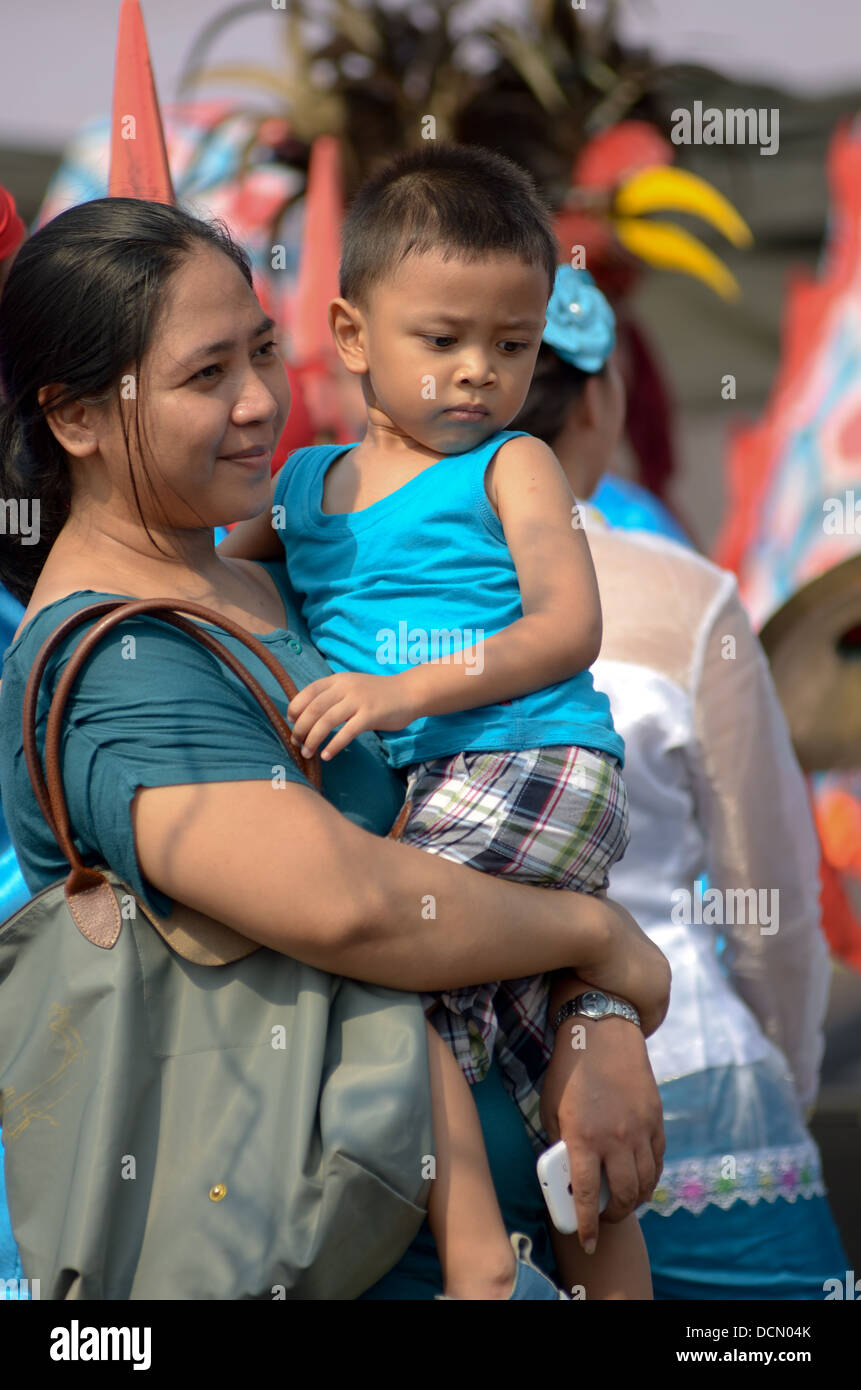 Moms and his kids watching street culture festival Stock Photo