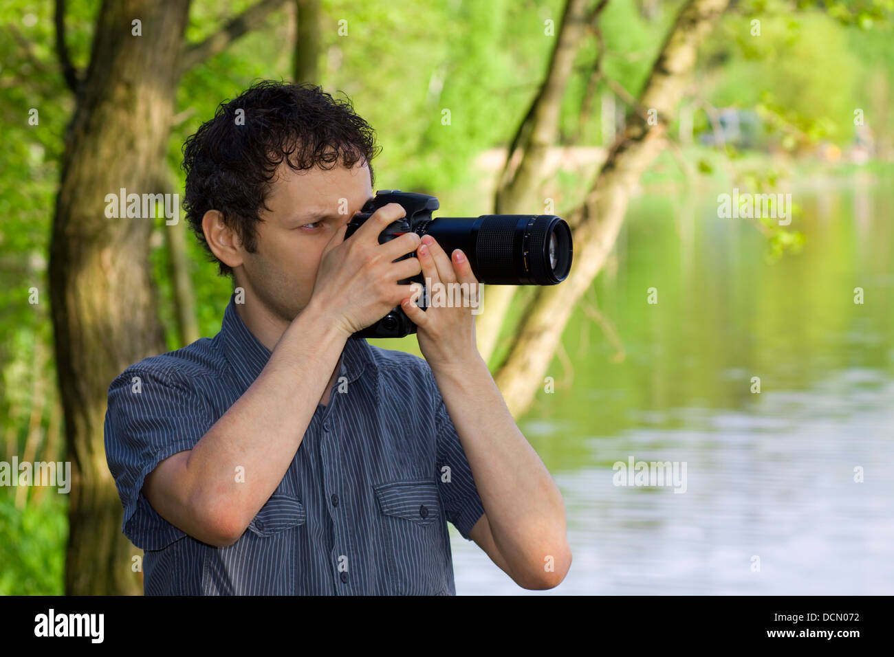 Sneaky photographer getting his shot of nature Stock Photo