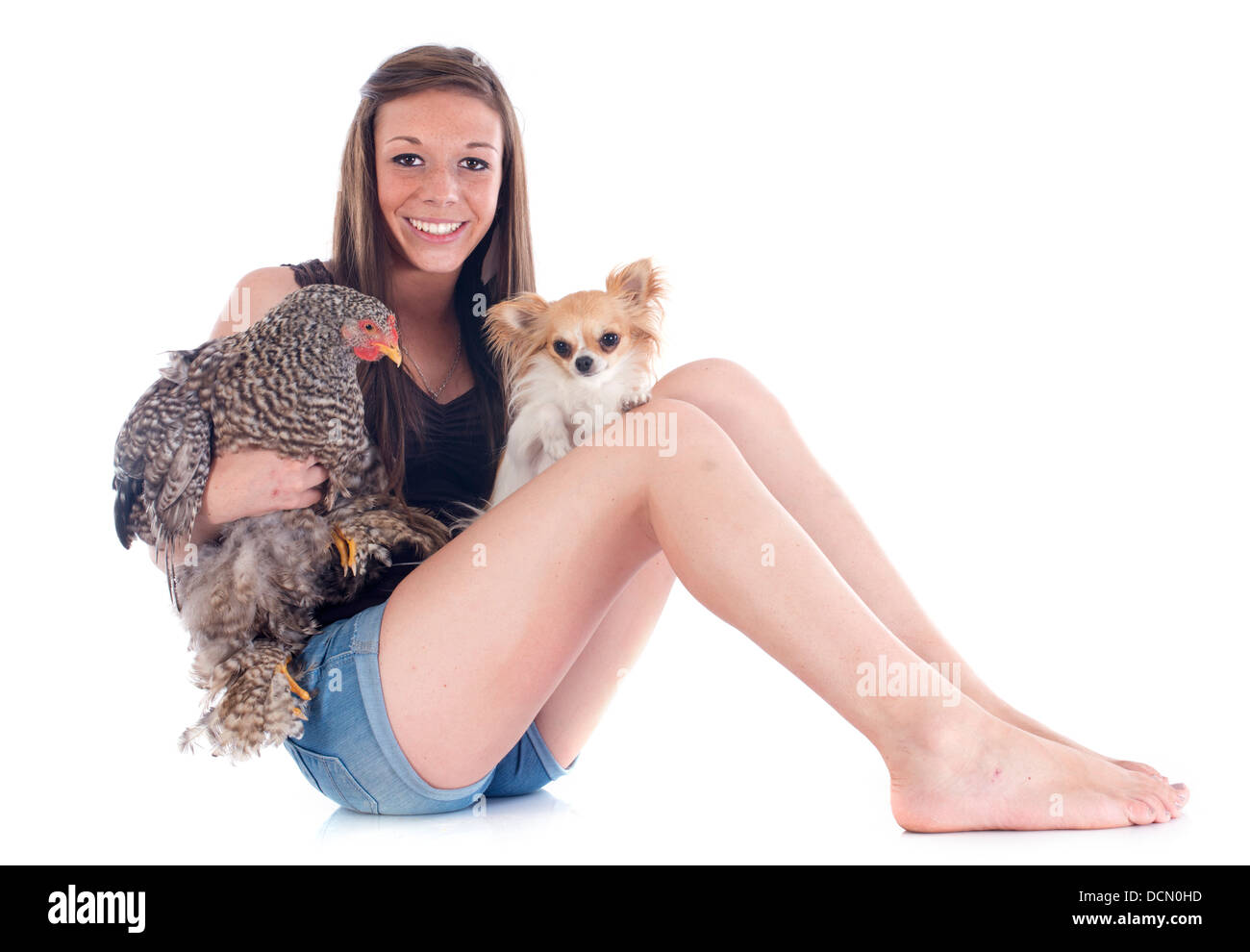 Young girl trying to catch a chicken stock photo (282078) - YouWorkForThem