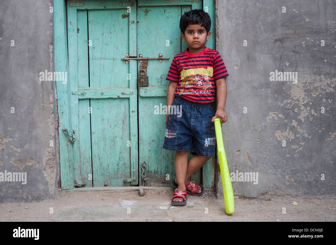 Young Indian Boy with cricket bat -  Jodhpur, Rajasthan, India Stock Photo