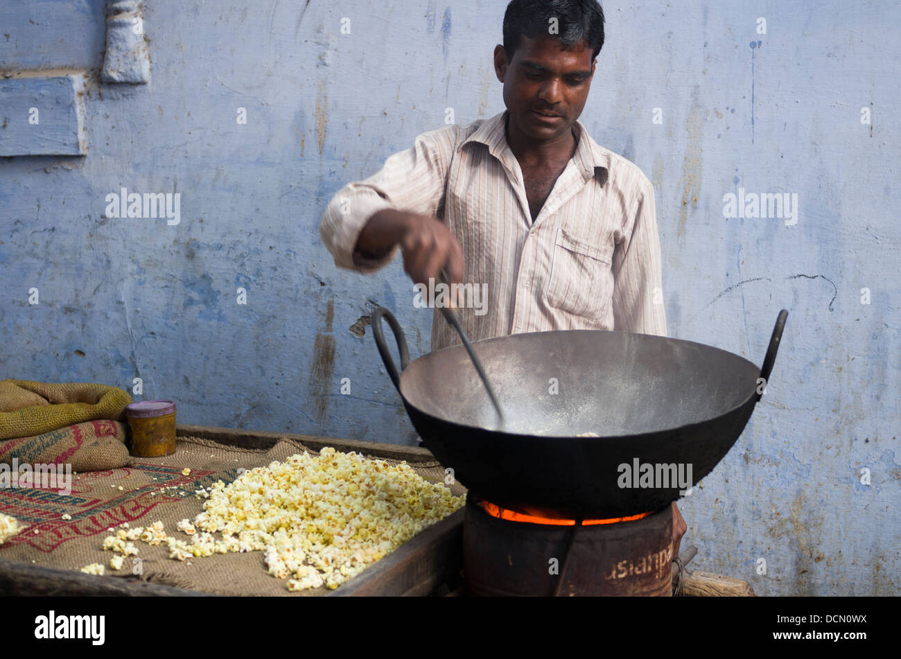 Popcorn maker & Blue City Walls - Jodhpur, Rajashtan, India Stock Photo