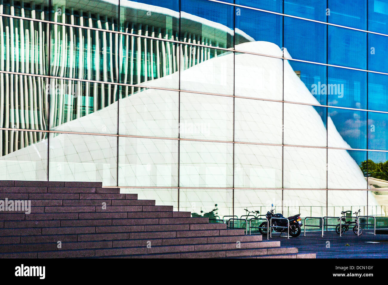 The Philharmonie concert hall reflected in the glass facade of the European Conference & Congress Centre in Luxembourg City. Stock Photo